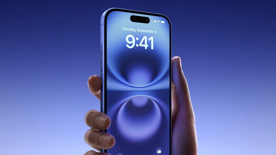 Holding the iPhone 16